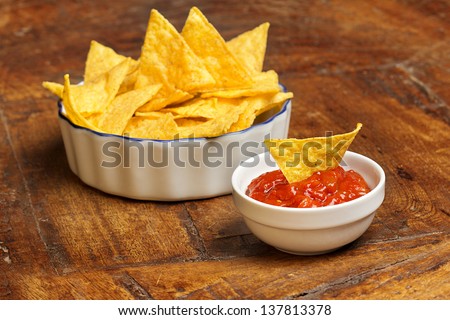 mexican appetizer of tortilla chips and tomato sauce