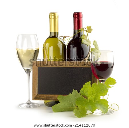 wine bottles, wineglasses and small chalkboard on white background