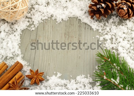 decorations and snow on a wooden table