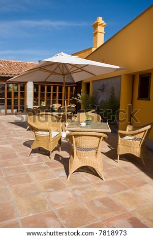 Luxury outdoor furniture in a typical patio on a sunny day