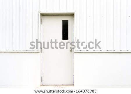 shut doors on a white wall