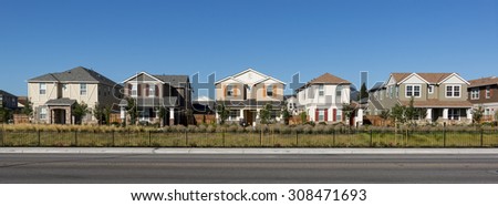A front view of a row of new houses.