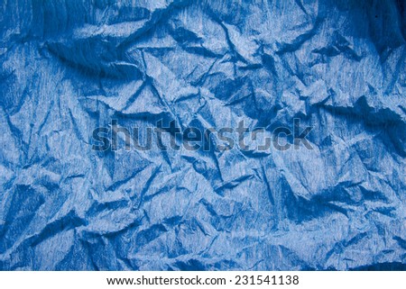 crumpled blue crepe paper texture as background