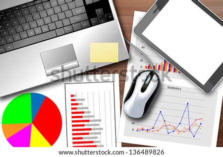Desk with a laptop and a set of statistics to monitor the progress of the business