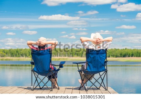 Similar – Image, Stock Photo Traveling couple near lake in forest