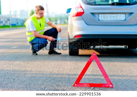 warning triangle and help the mechanic on the road