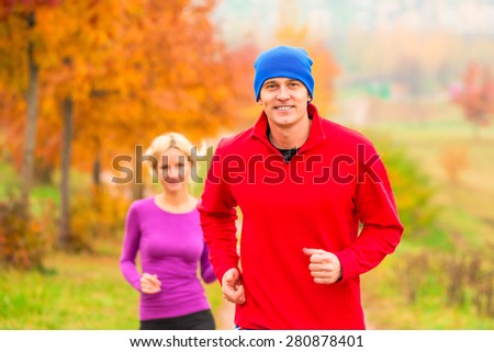 young married couple athletes on the morning jog