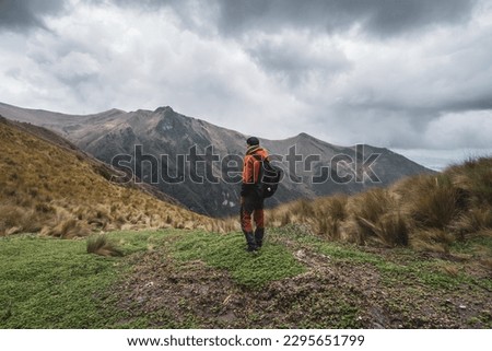 Similar – Image, Stock Photo Man standing in volcanic valley during trip