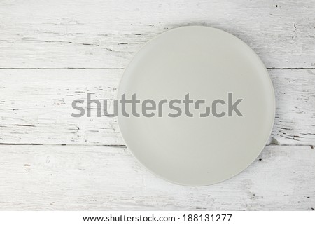 Empty clean plate  on white table