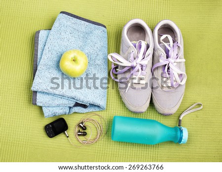Pair of sport shoes and fitness accessories. Fitness concept