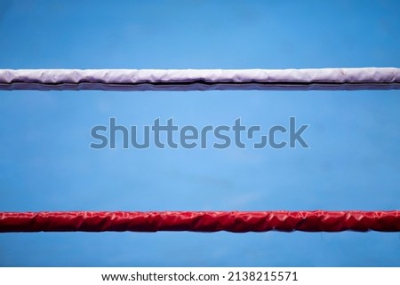 Boxing and muy thay ring ropes with a blur spotlight. Vertical sport theme poster, greeting cards, headers, website and app. Professional sport concept. Foto stock © 