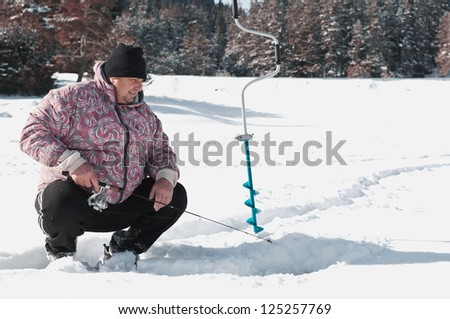 Ice Fishing I. Mature male ice fishing