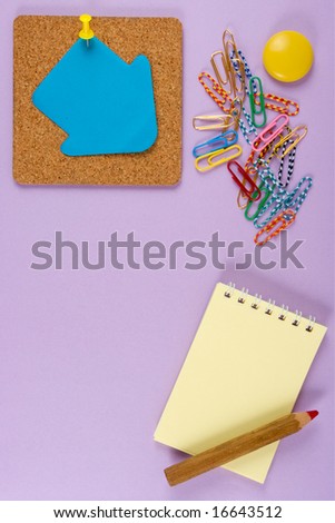 Cork, clip, pencil and paper. At lilac background.The model for posting your pictures or inscriptions.