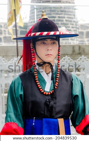 SEOUL, SOUTH KOREA - JUNE 22 Royal guard on June 22, 2014, Seoul, South Korea. Guards in medieval clothes had been protected the Gyeongbok Palace for centuries.