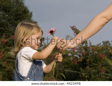 Child giving flower