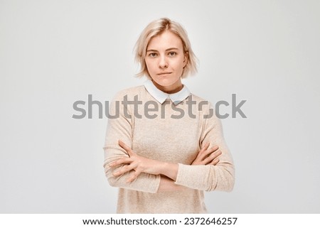 Similar – Image, Stock Photo Serious female with makeup and freckles on nose gently and looking at camera
