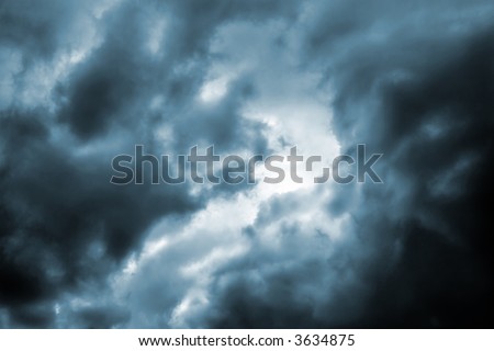Ominous dark thunderstorm clouds in the sky(cyan toned version)