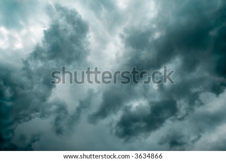 Ominous dark thunderstorm clouds in the sky(green-cyan toned version)