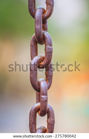 Rusty iron chain hanging down