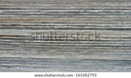 Wasted and damaged real floor wood texture in pale tones also useful as background.
