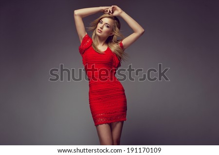 Sexy young beauty woman in red dress