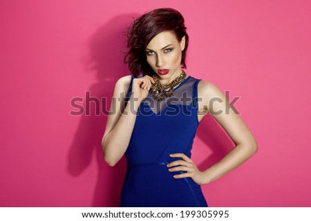Glamorous girl wearing blue dress