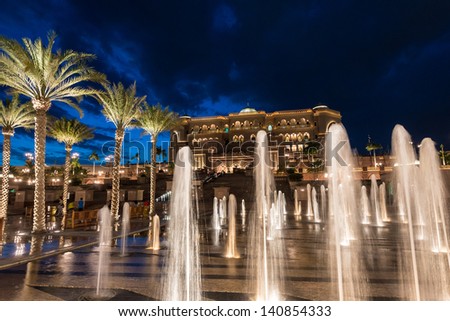 ABU DHABI, UAE - MAY 1: Emirates Palace hotel with fountain on May 1, 2013. Emirates Palace is a luxurious and the most expensive 7 star hotel designed by renowned architect, John Elliott RIBA.