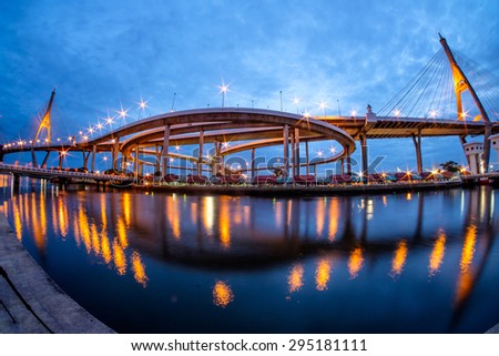 Bhumibol Bridge at sunset with fisheye view. It is also known as the Industrial Ring Road Bridge, in Thailand. The bridge crosses the Chao Phraya River twice.