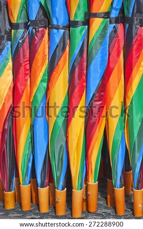 Extra bright colorful umbrellas texture.Colors of rainbow, lines of spiral. Useful for background