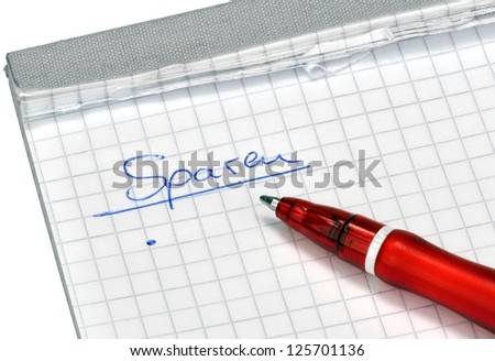 Red pencil for cutbacks list on a writing pad
