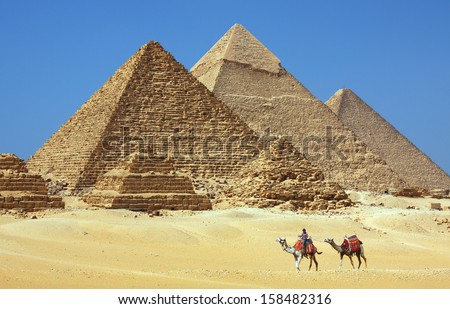CAIRO - JULY 3: The pyramids at Giza near Cairo, Egypt on July 3, 2010. The Great Pyramid of Khufu is the only one of the Seven Wonders of the Ancient World still in existence.