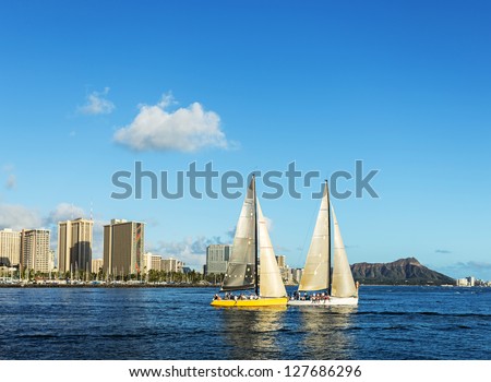 Two sailboat in the sea with Diamond head mountain background, Honolulu Hawaii