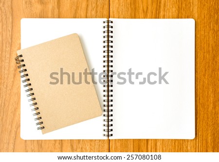 Spiral notebook on wood background