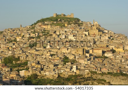 view of the houses and the churches on the hill on which stands the village of Agira in Sicily
