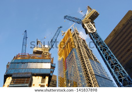 low view of the cranes to build new skyscrapers in the City of London