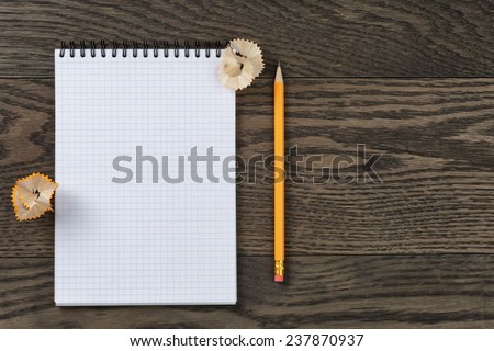 open notebook for writing or drawing on oak table, copy space for something