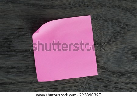 purple sticky note on wooden table, template