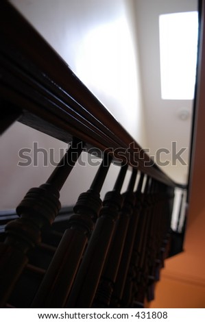 Stairs with wooden railing