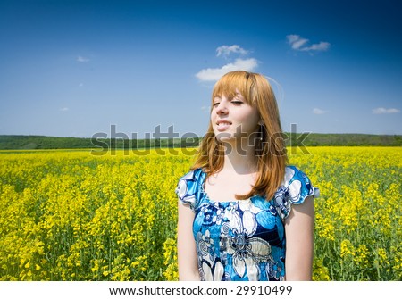 Pretty blonde in a rapeseed field