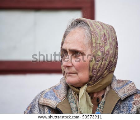 Closeup portrait of a sad old woman