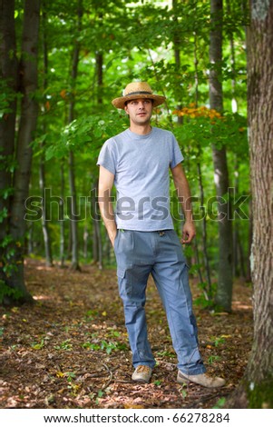 Portrait of a young farmer in the forest