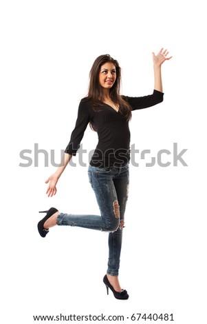 Full length shot of a beautiful hispanic woman in high heels and jeans, isolated on white background