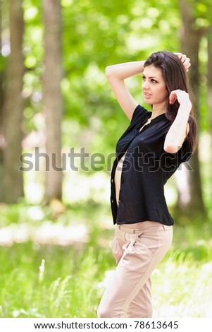 Portrait of a beautiful latin young woman outdoor in the forest