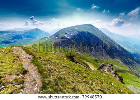 Landscape with Transalpina road and Urdele peak of Parang mountains in Romania