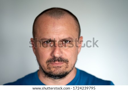 Closeup of a man with black beard and hostile expression Stock foto © 