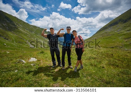 Group of hikers on a trail in the mountains in a beautiful scenery