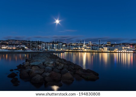 City harbor lights of Wellington with lights reflection and bright moonlight too.