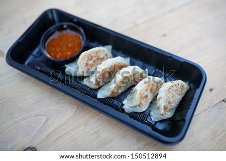 Fried Potstickers, Dumplings, Traditional Asian Food, Stuffed with Pork Meat or Vegetables