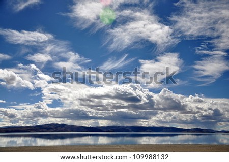 Beautiful Lake and Clouds Lhanag-tso Lake appears dark blue and is very salty. There are no plants, no cattle or sheep around the lake. That\'s why the lake is called the \