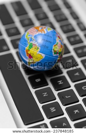World wide web concept with globe on laptop.